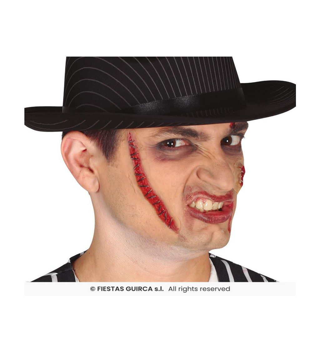Zašitá latexová jizva